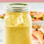 Closeup of a jar of homemade green onion salad dressing.