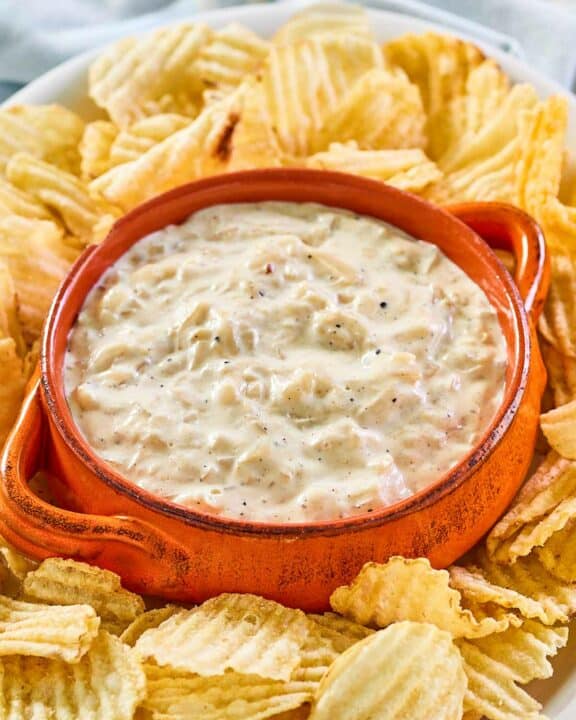Ina Garten onion dip and thick-cut potato chips on a platter.