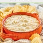 Ina Garten onion dip in an orange bowl and potato chips around it.