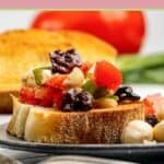 Marinated mozzarella balls on top of toasted bread.