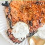 A dollop of homemade Outback Steakhouse tiger dill sauce on a steak.