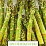 Roasted asparagus spears on a white platter.