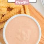 Overhead view of homemade Raising Cane's sauce and crinkle-cut French fries.