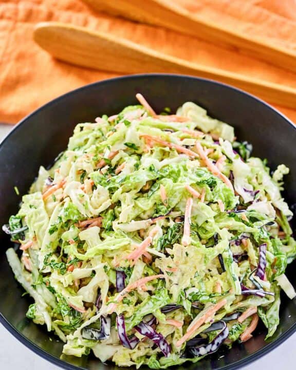 A bowl of sweet and sour coleslaw.