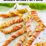 Several bacon wrapped stuffed hatch green chile peppers on parchment.
