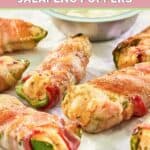 Buffalo chicken poppers on parchment paper.