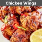 Closeup of homemade Buffalo Wild Wings Asian Zing chicken wings on a white plate.