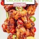 Overhead view of homemade Buffalo Wild Wings Asian Zing chicken wings on a plate.
