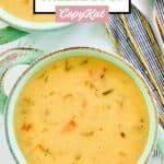 Overhead view of cheddar cheese soup in a soup crock.