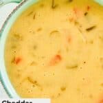 Closeup of a bowl of cheddar cheese soup.