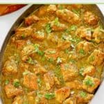 Chili verde in a large oval skillet.