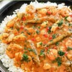 Homemade Commander's Palace seafood gumbo over rice in a bowl.