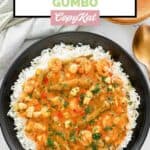 Overhead view of homemade Commander's Palace seafood gumbo over rice.