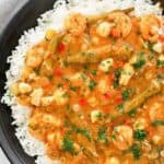 Overhead view of homemade Commander's Palace seafood gumbo over rice.