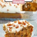 A slice of homemade Cracker Barrel carrot cake with cream cheese frosting on a blue plate.