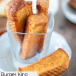 Homemade Burger King French toast sticks in a glass on a plate.