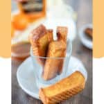 Homemade Burger King French toast sticks in a small glass cup on a white plate.