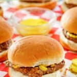 Homemade Krystal burger and mustard in a small glass bowl.