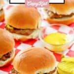 Homemade Krystal burgers, pickle slices, and mustard in a bowl.