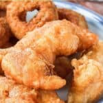Three homemade Long John Silver's chicken planks on a plate.