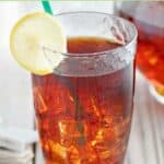 A glass of homemade McDonald's sweet tea and garnished with lemon.