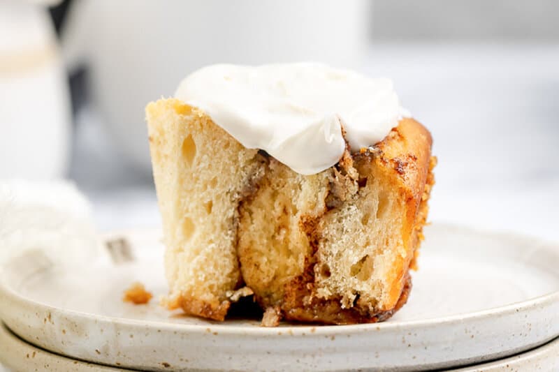 Closeup of a homemade overnight cinnamon roll with cream cheese frosting.