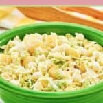 Pineapple coleslaw in a green serving bowl.