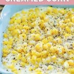 Homemade Rudy's creamed corn in a blue serving dish.