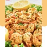 Shrimp remoulade and a lemon on a platter.