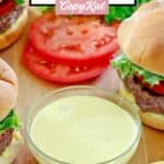A bowl of homemade Smashburger smash sauce next to burgers.