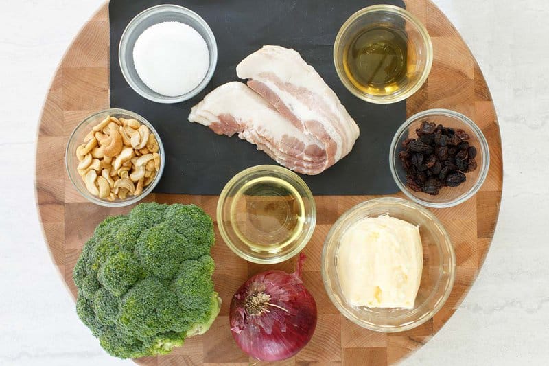 Copycat Sweet Tomatoes Joan's broccoli madness salad ingredient on a wood board.