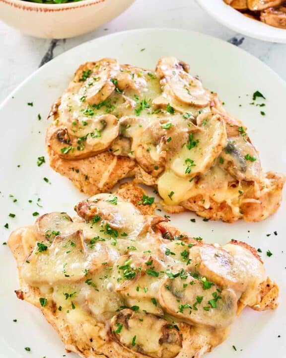 Copycat Texas Roadhouse smothered chicken on a plate.