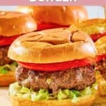 Homemade 21 Club burger with lettuce and tomato.