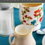 Homemade amaretto coffee creamer, sugar, and a cup of coffee.