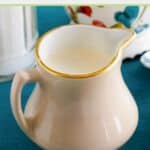 Homemade amaretto coffee creamer in a small white pitcher.