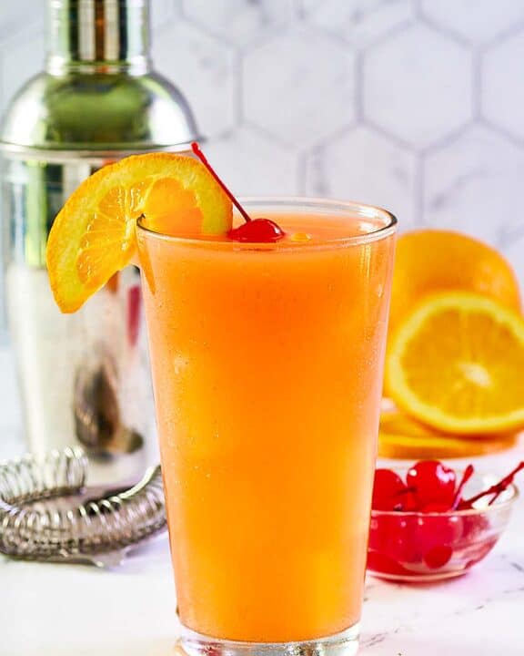 Copycat Applebee's Bahama Mama drink garnished with an orange slice and cherry.