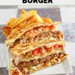 Homemade Applebee's quesadilla burger and French fries on a rectangular plate.