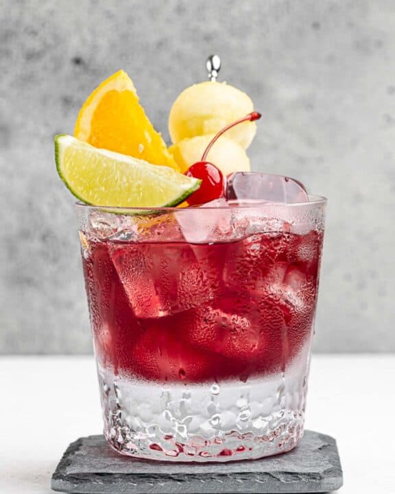 Copycat Applebee's red apple sangria on a coaster.