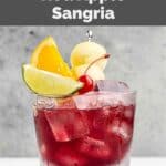 Homemade Applebee's red apple sangria garnished with apple and fruit.
