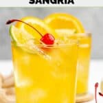 Homemade Applebee's white peach sangria in a cocktail glass.