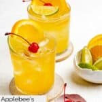 Homemade Applebee's white peach sangria drinks and a bowl of cherries.