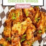 Overhead view of General Tso wings in a parchment paper lined basket.