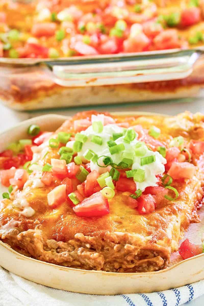 Closeup of burrito casserole serving on a plate.
