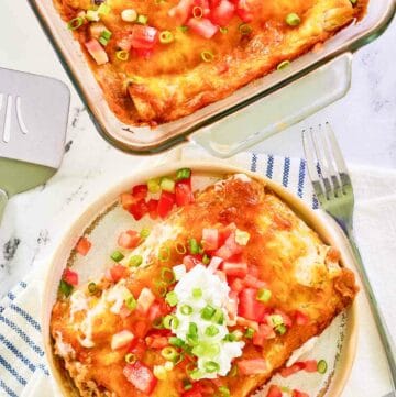 Overhead view of burrito casserole in a baking dish and on a plate.
