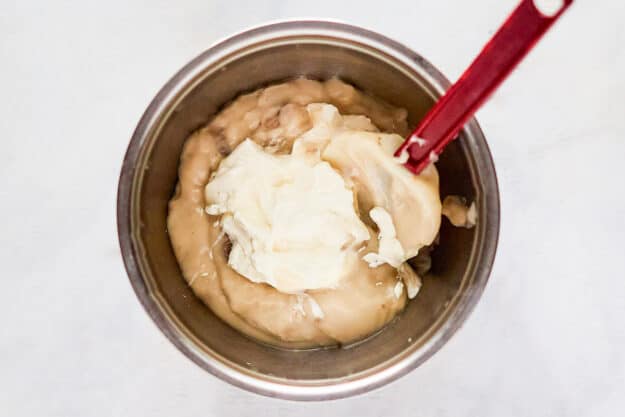 Mushroom soup and sour cream in a bowl.
