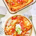 Overhead view of burrito casserole in a glass casserole dish and a serving on a plate.