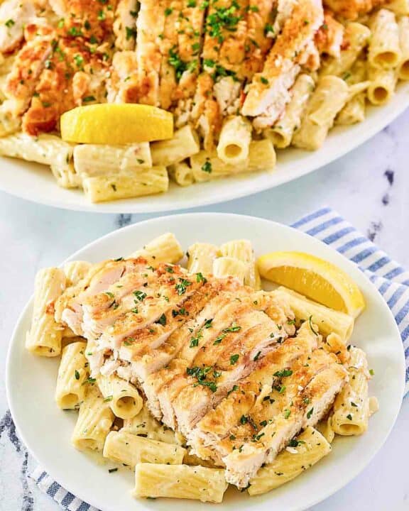 Copycat Biltmore Estate gorgonzola chicken pasta on a platter and plate.