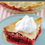 Fruit of the forest pie slice with whipped cream on top.
