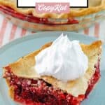 Fruit of the forest pie slice topped with whipped cream.