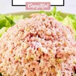 A scoop of homemade ham salad on top of lettuce.